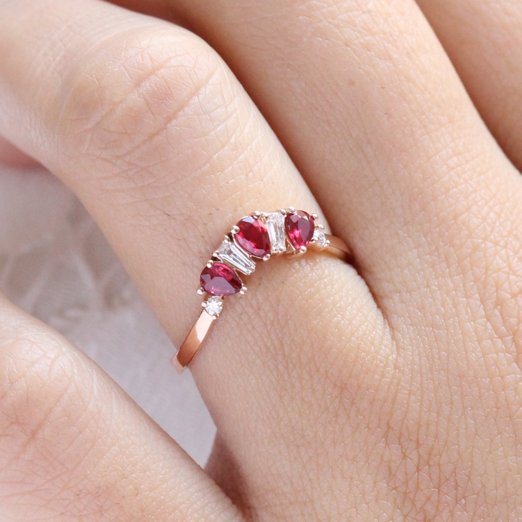 pear and baguette diamond and ruby ring rose gold curved wedding band by la more design jewelry