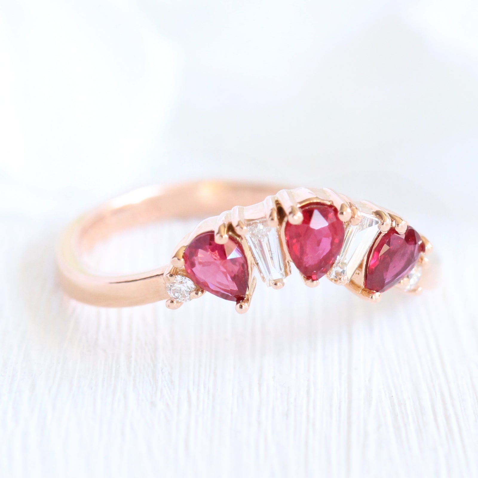 pear and baguette diamond and ruby ring rose gold curved wedding band by la more design jewelry