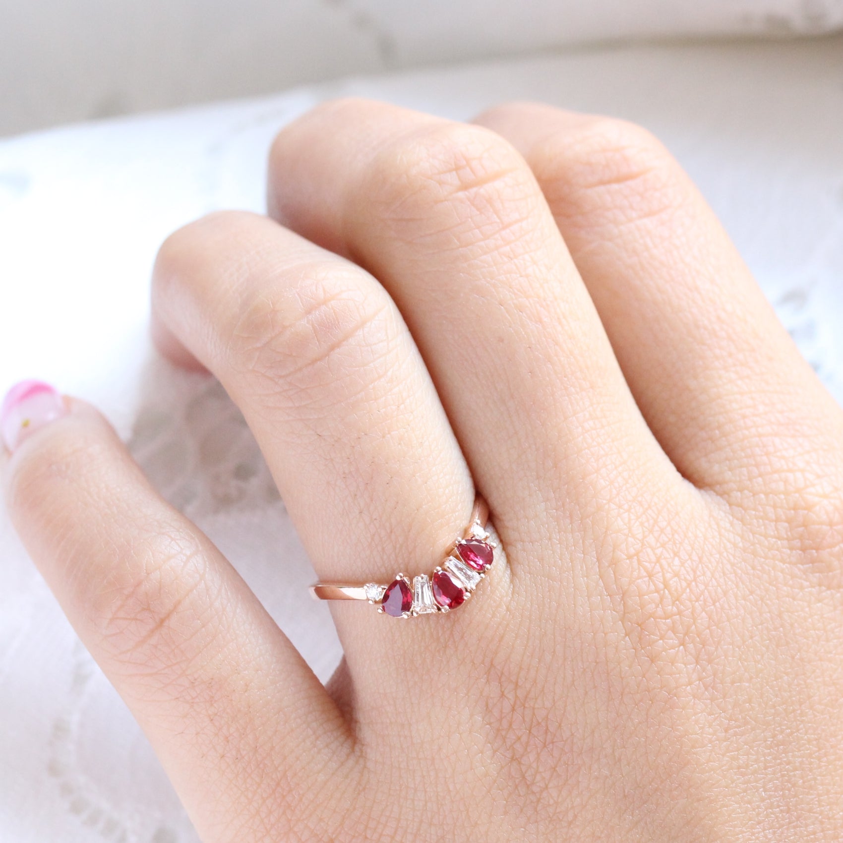 pear and baguette diamond and ruby ring rose gold curved wedding band by la more design jewelry