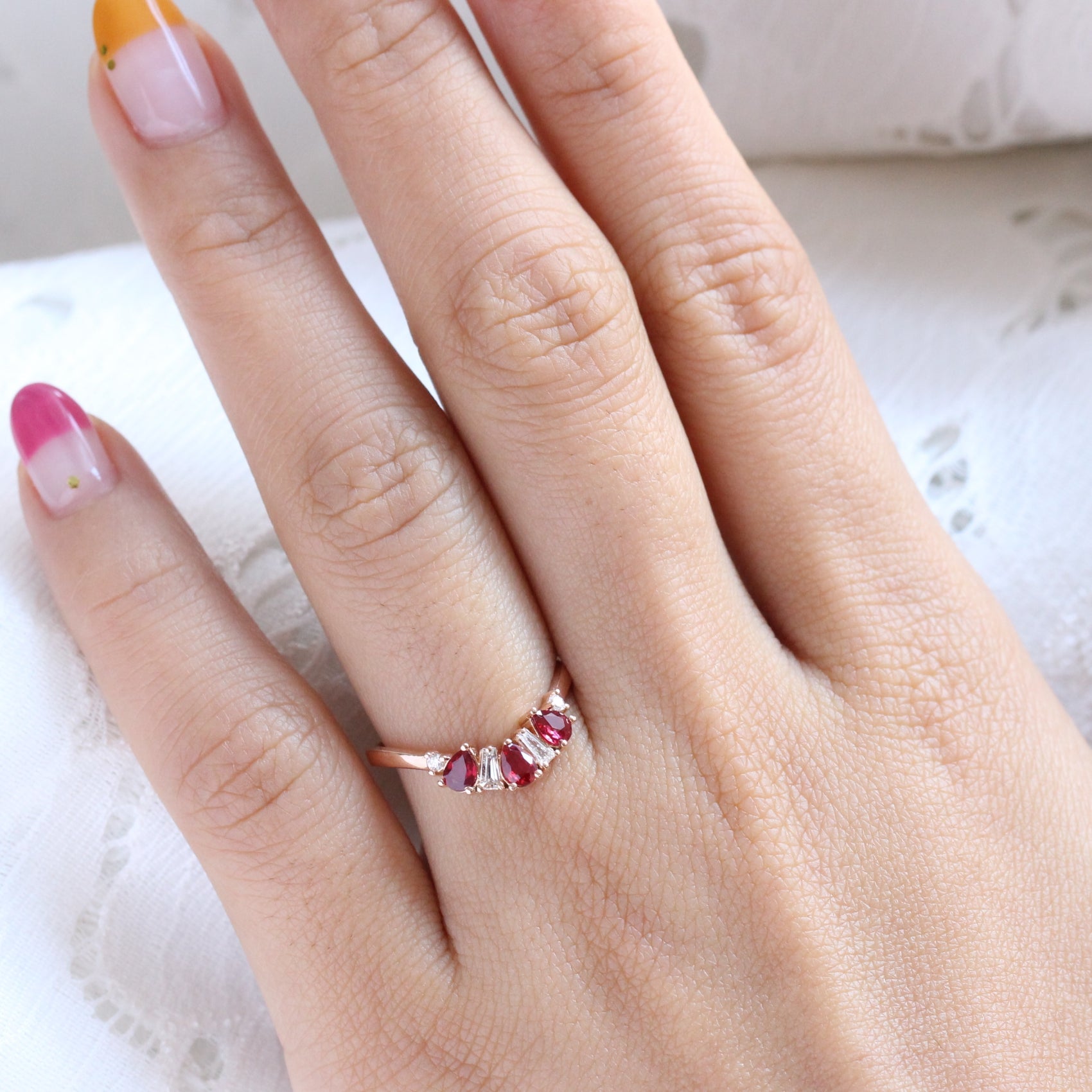pear and baguette diamond and ruby ring rose gold curved wedding band by la more design jewelry