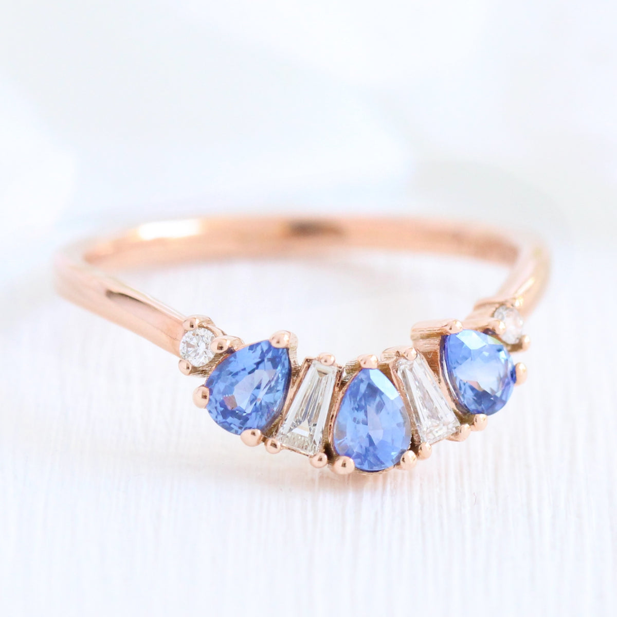 pear and baguette diamond and sapphire ring rose gold curved wedding band by la more design jewelry