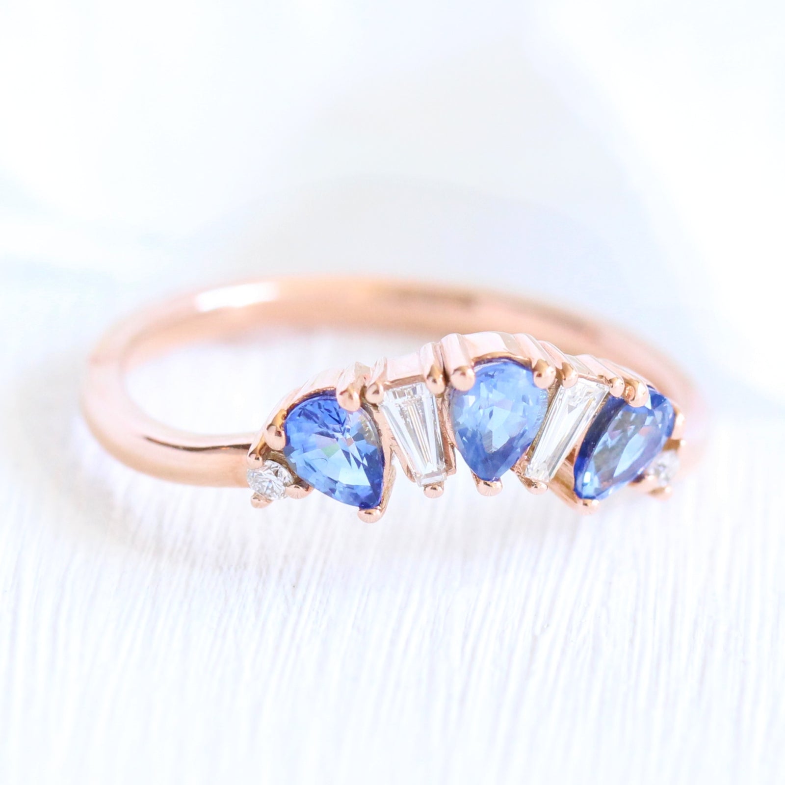 pear and baguette diamond and sapphire ring rose gold curved wedding band by la more design jewelry