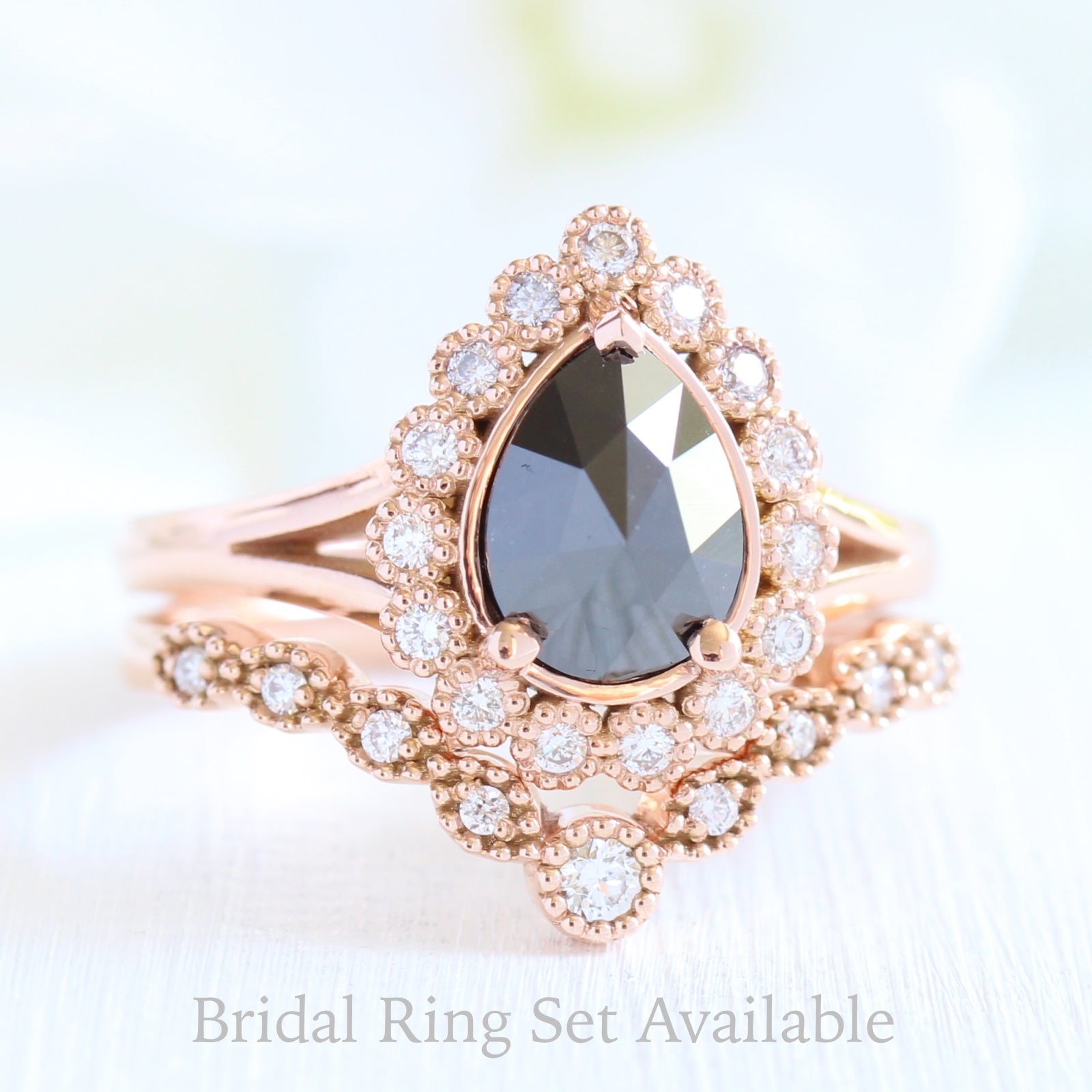 pear rose cut black diamond ring rose gold and curved diamond wedding ring set by la more design