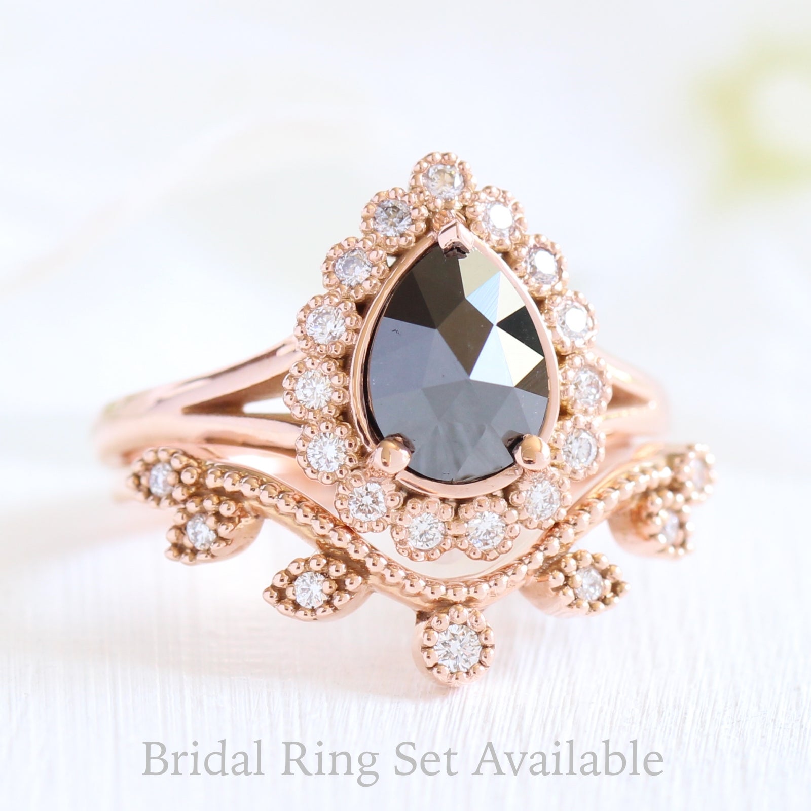 pear rose cut black diamond ring rose gold and curved leaf diamond wedding ring set by la more design