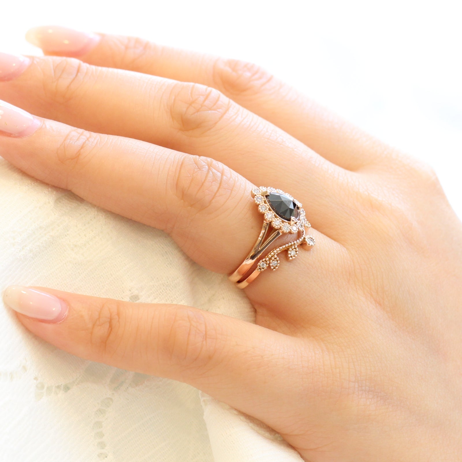 pear rose cut black diamond ring rose gold and curved leaf diamond wedding ring set by la more design