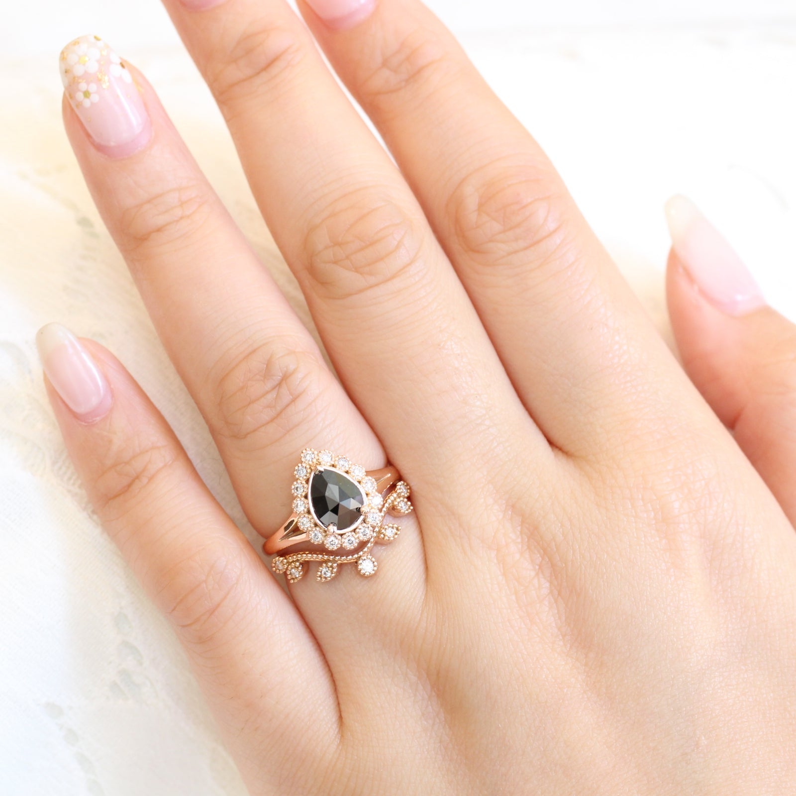 pear rose cut black diamond ring rose gold and curved leaf diamond wedding ring set by la more design