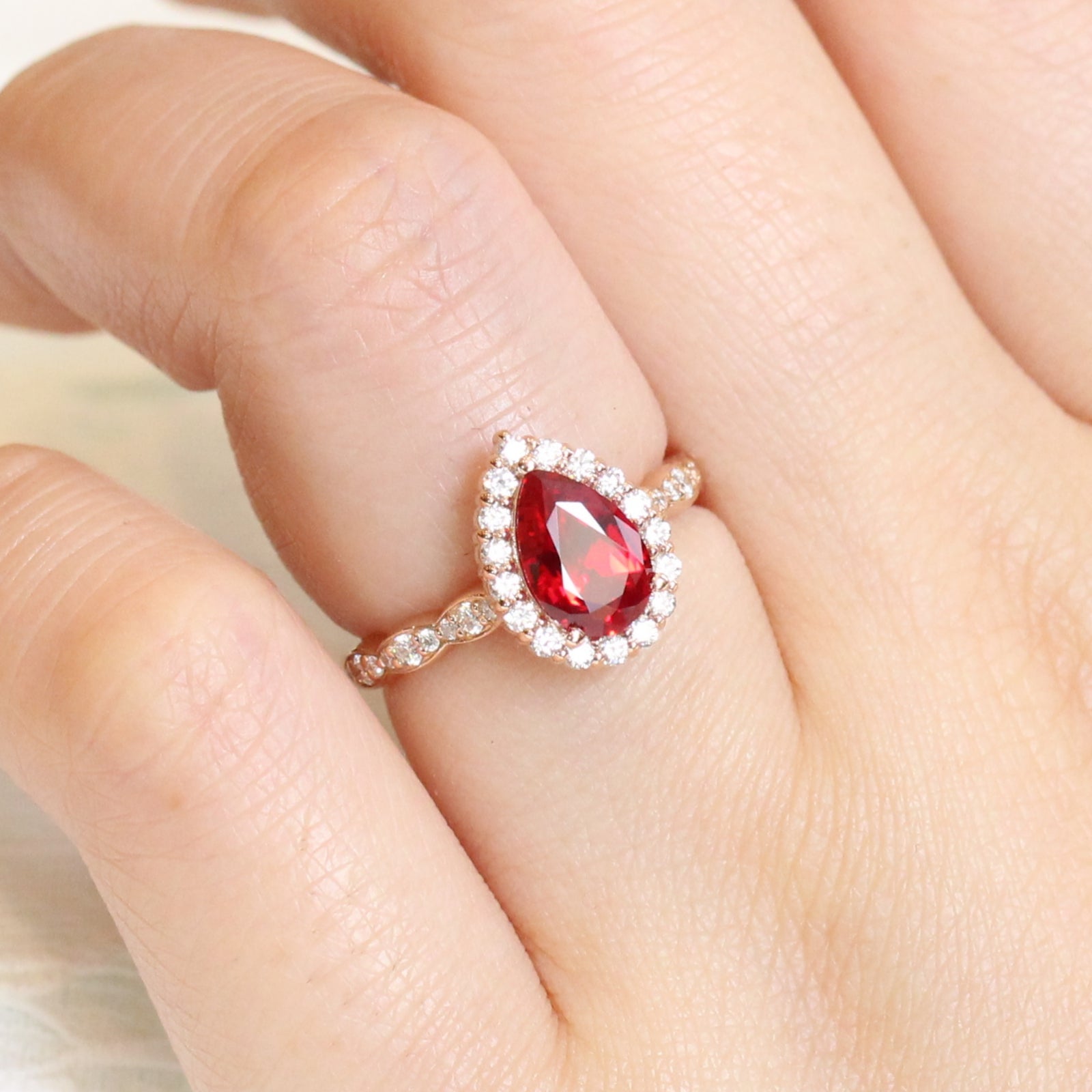 pear ruby engagement ring rose gold halo diamond ring by la more design jewelry