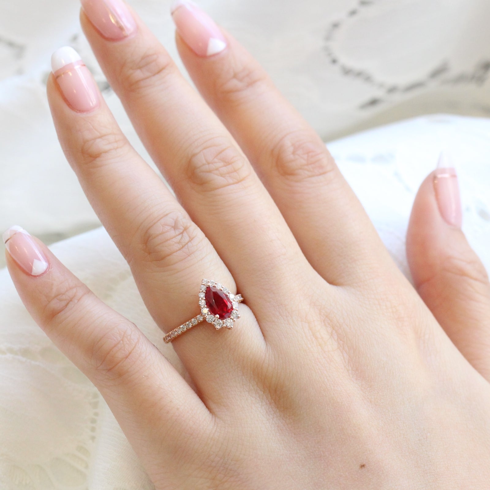 pear shaped ruby engagement ring rose gold halo diamond ring low profile ring by la more design jewelry