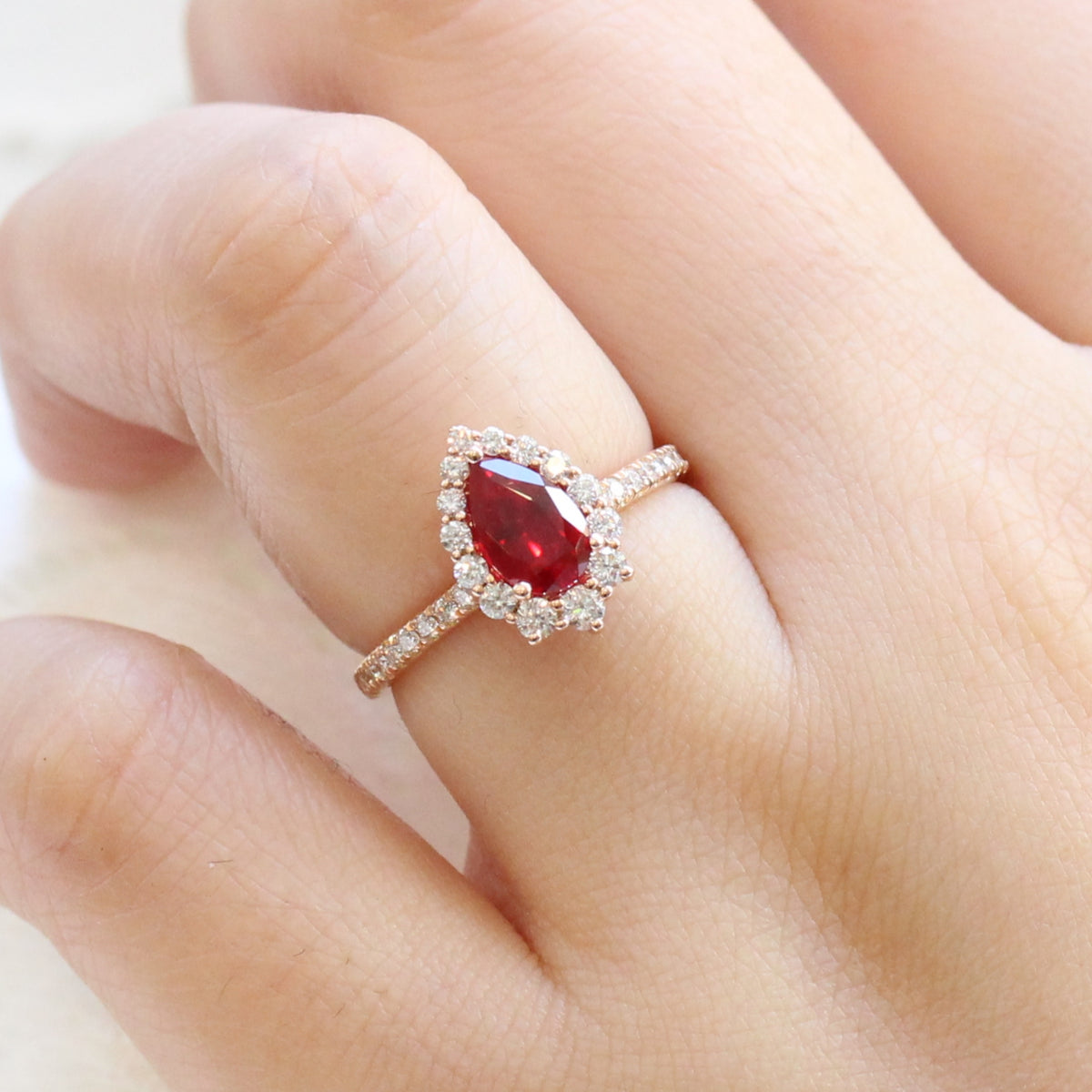 pear shaped ruby engagement ring rose gold halo diamond ring low profile ring by la more design jewelry