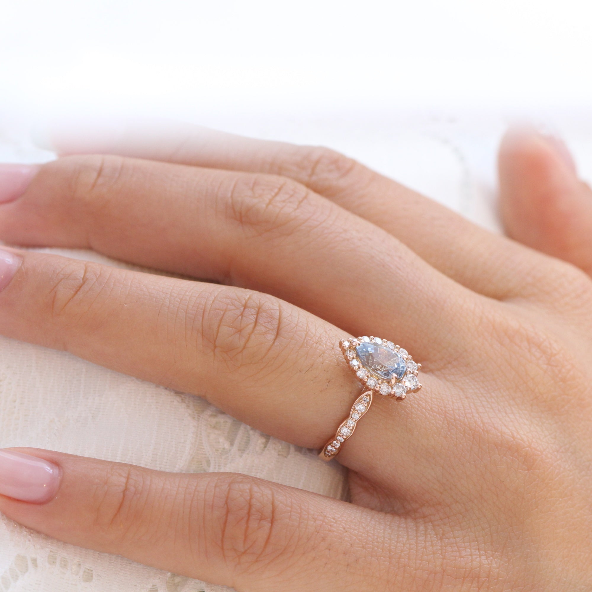 pear aqua blue sapphire ring rose gold halo diamond ring scalloped diamond band la more design jewelry