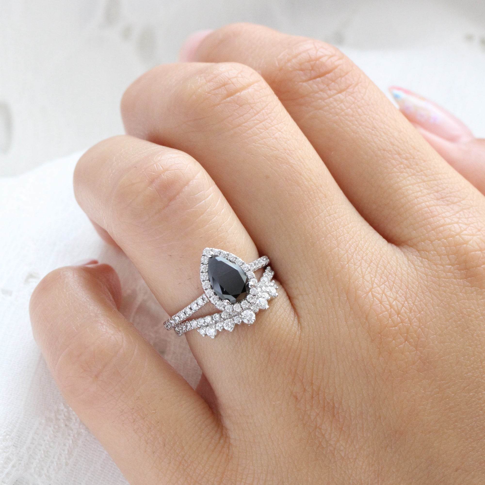 pear black diamond engagement ring and crown diamond wedding band in white gold halo ring bridal set by la more design jewelry