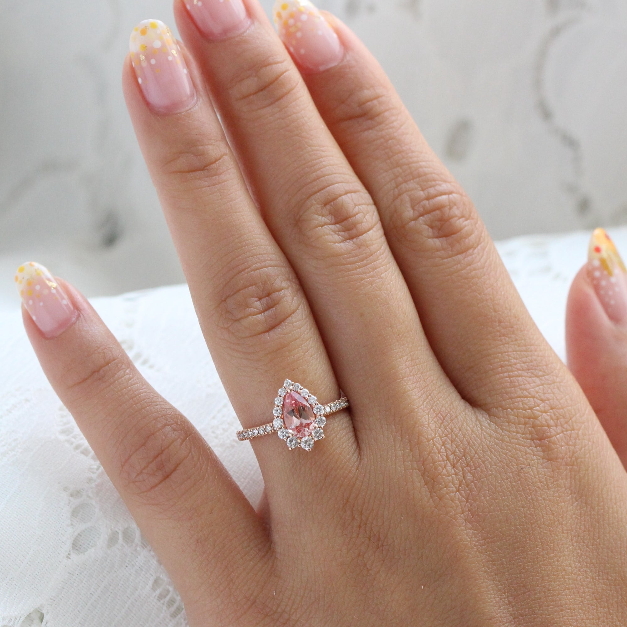 pear shaped peach sapphire engagement ring rose gold halo diamond ring by la more design jewelry