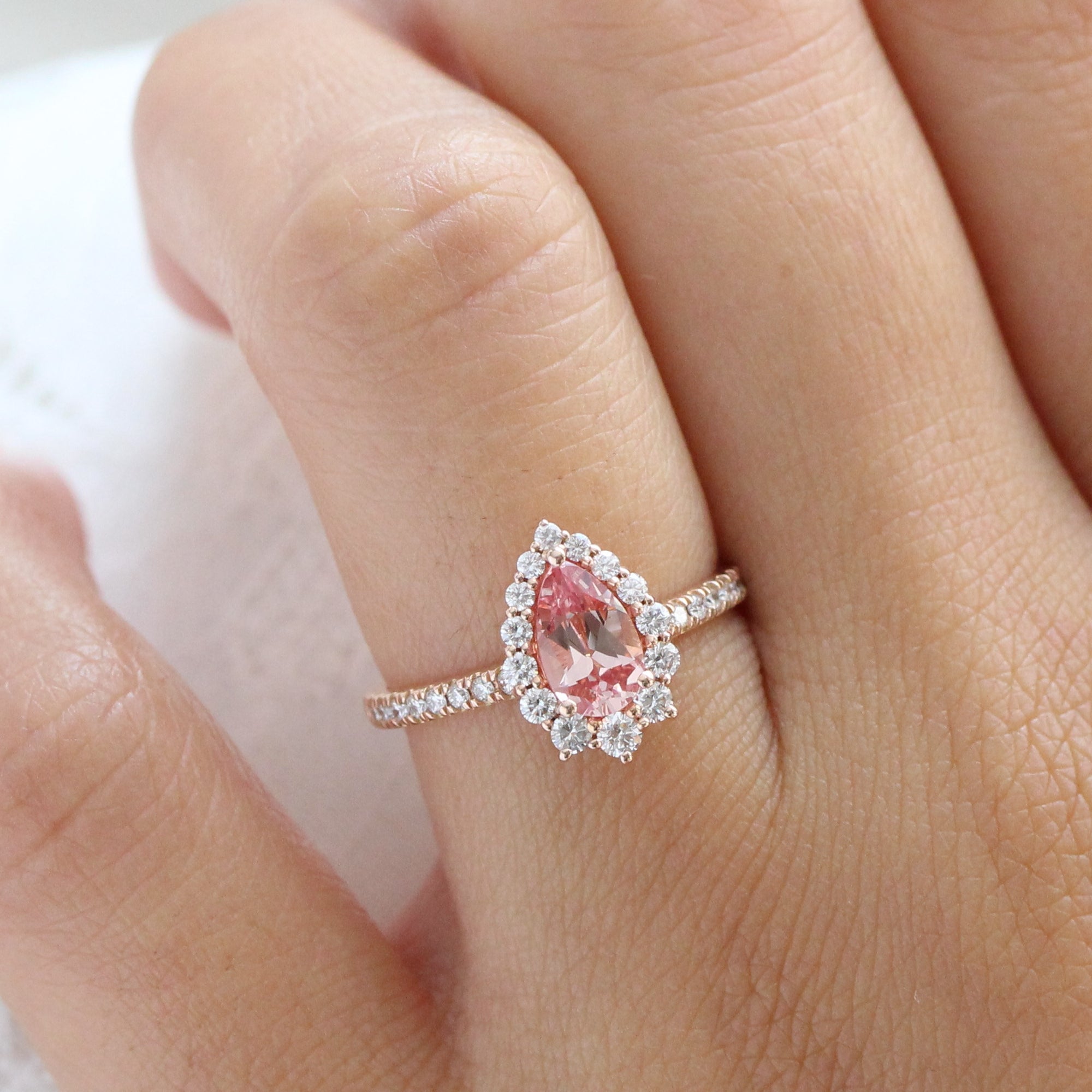pear shaped peach sapphire engagement ring rose gold halo diamond ring by la more design jewelry