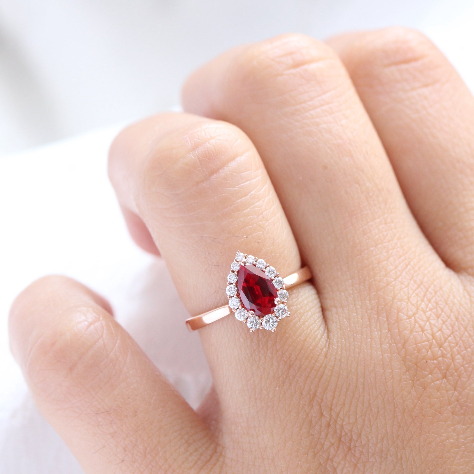 pear shaped ruby engagement ring rose gold halo diamond cluster ring la more design jewelry