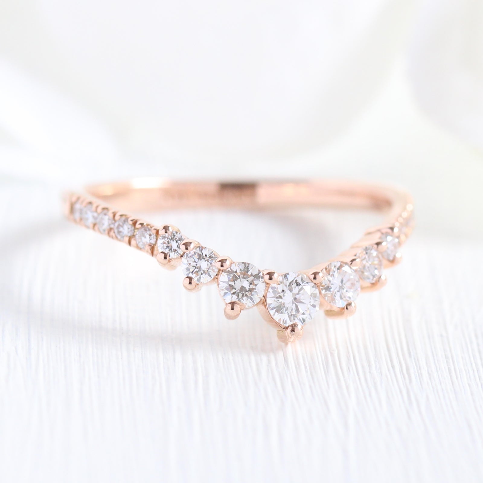 rose gold curved diamond wedding band in 7 stone diamond ring by la more design jewelry