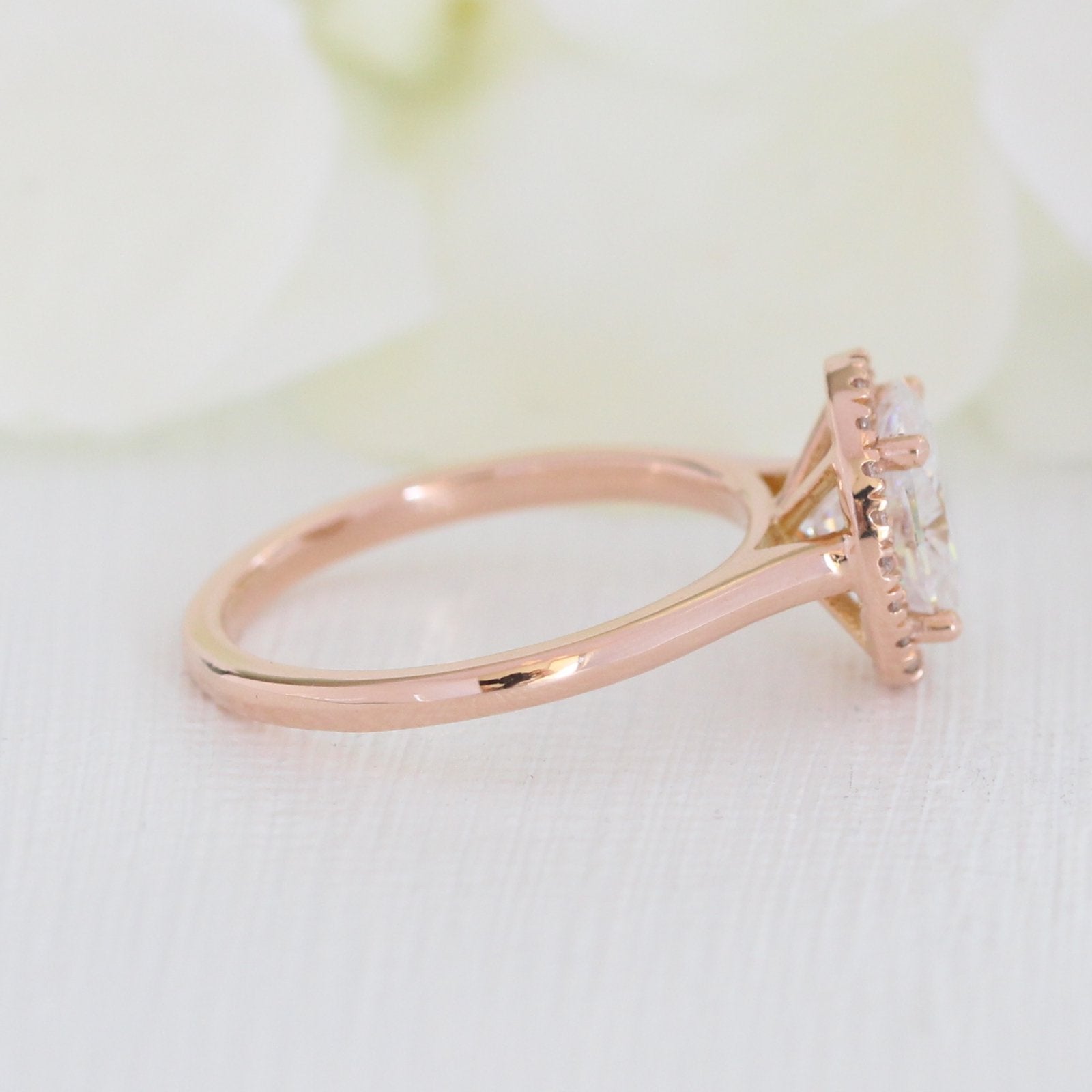 rose gold oval moissanite halo diamond ring set by la more design