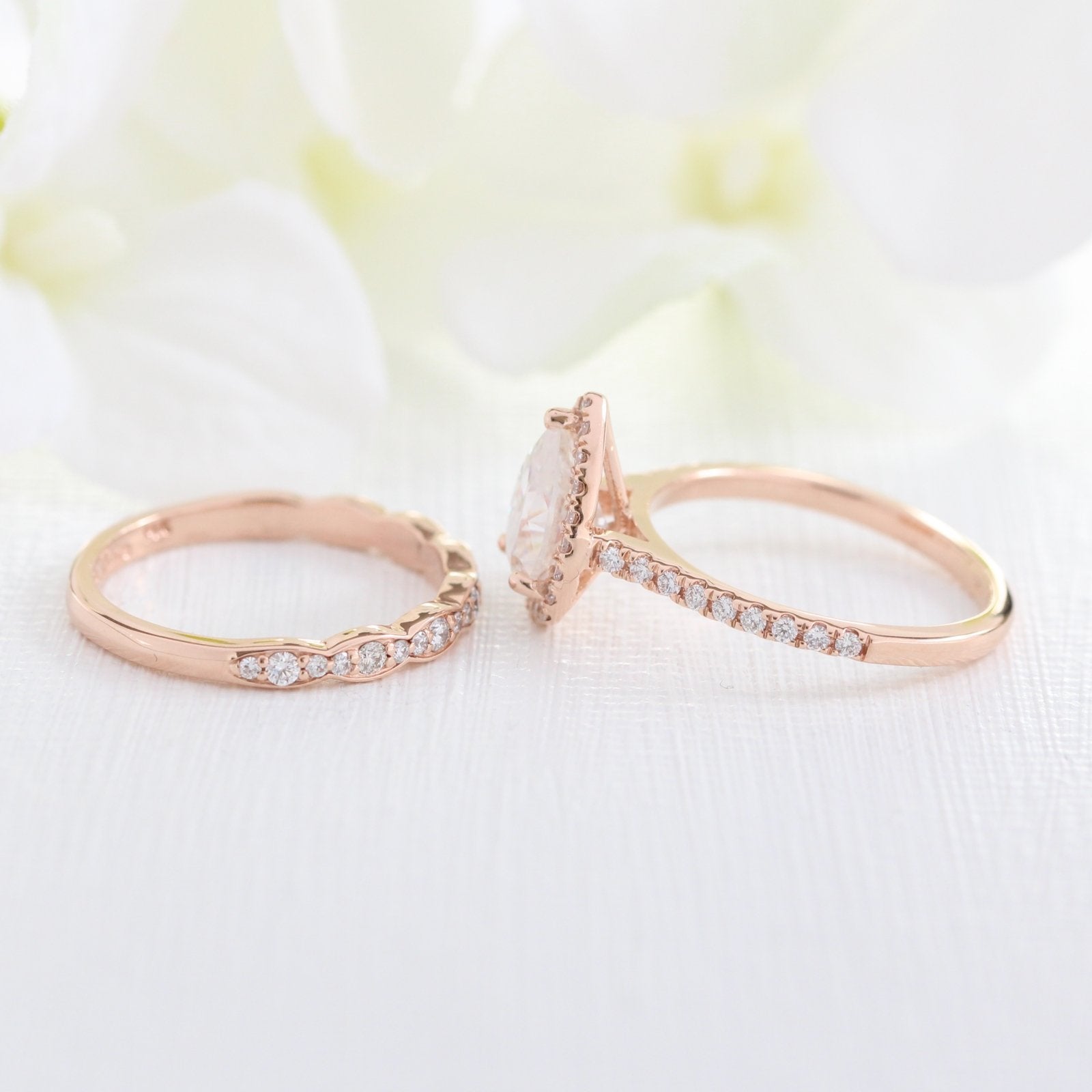 rose gold pear moissanite engagement ring bridal set and scalloped diamond band by la more design