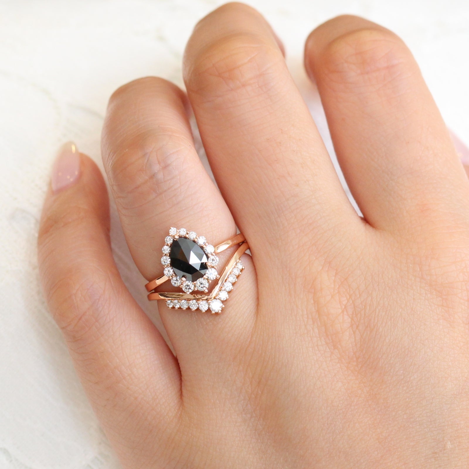 rose gold pear rose cut black diamond ring and v shaped diamond wedding ring set by la more design