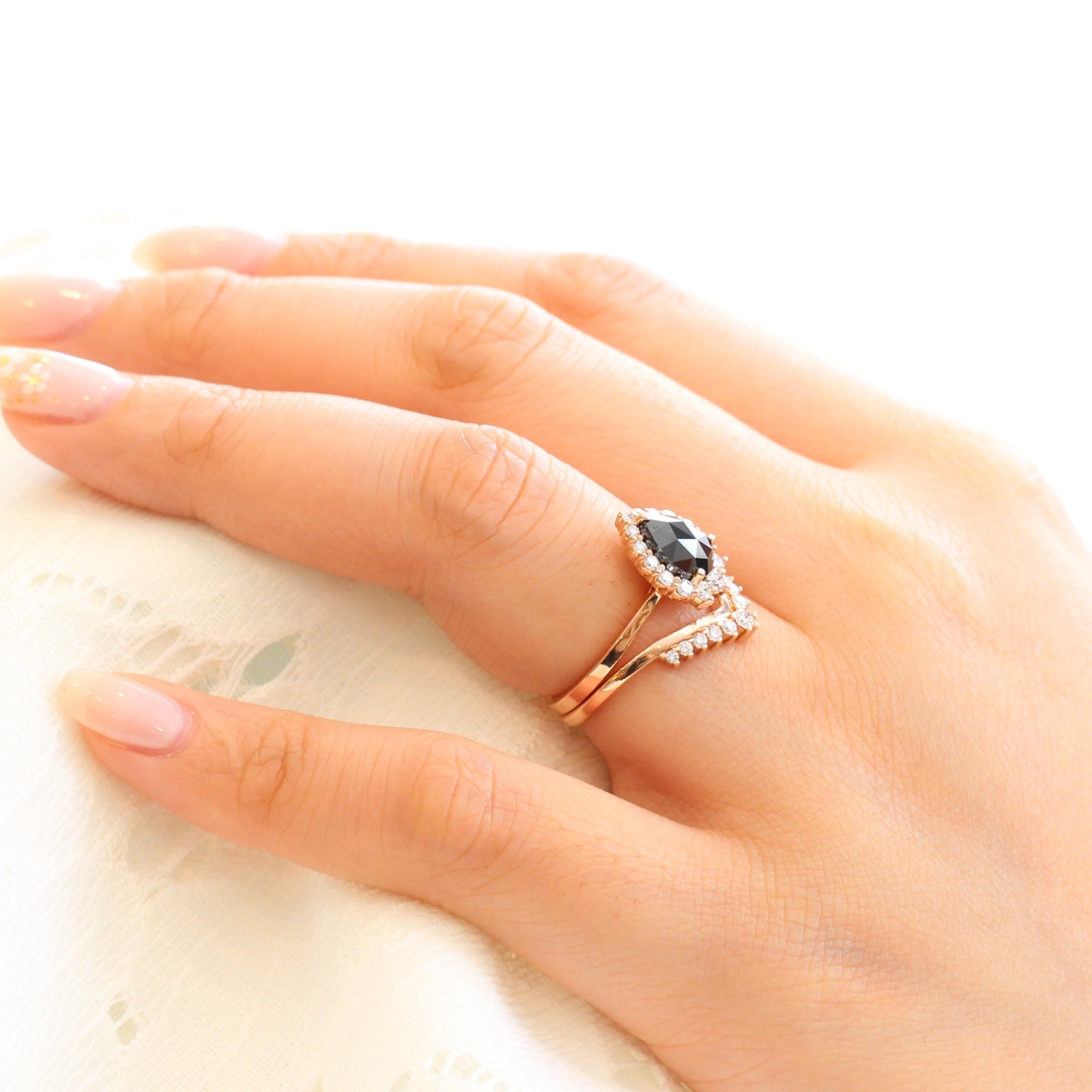 rose gold pear rose cut black diamond ring and v shaped diamond wedding ring set by la more design