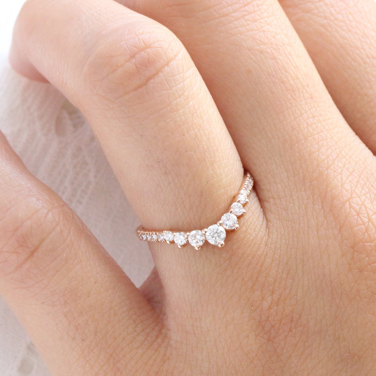 rose gold curved diamond wedding band in 7 stone diamond ring by la more design jewelry