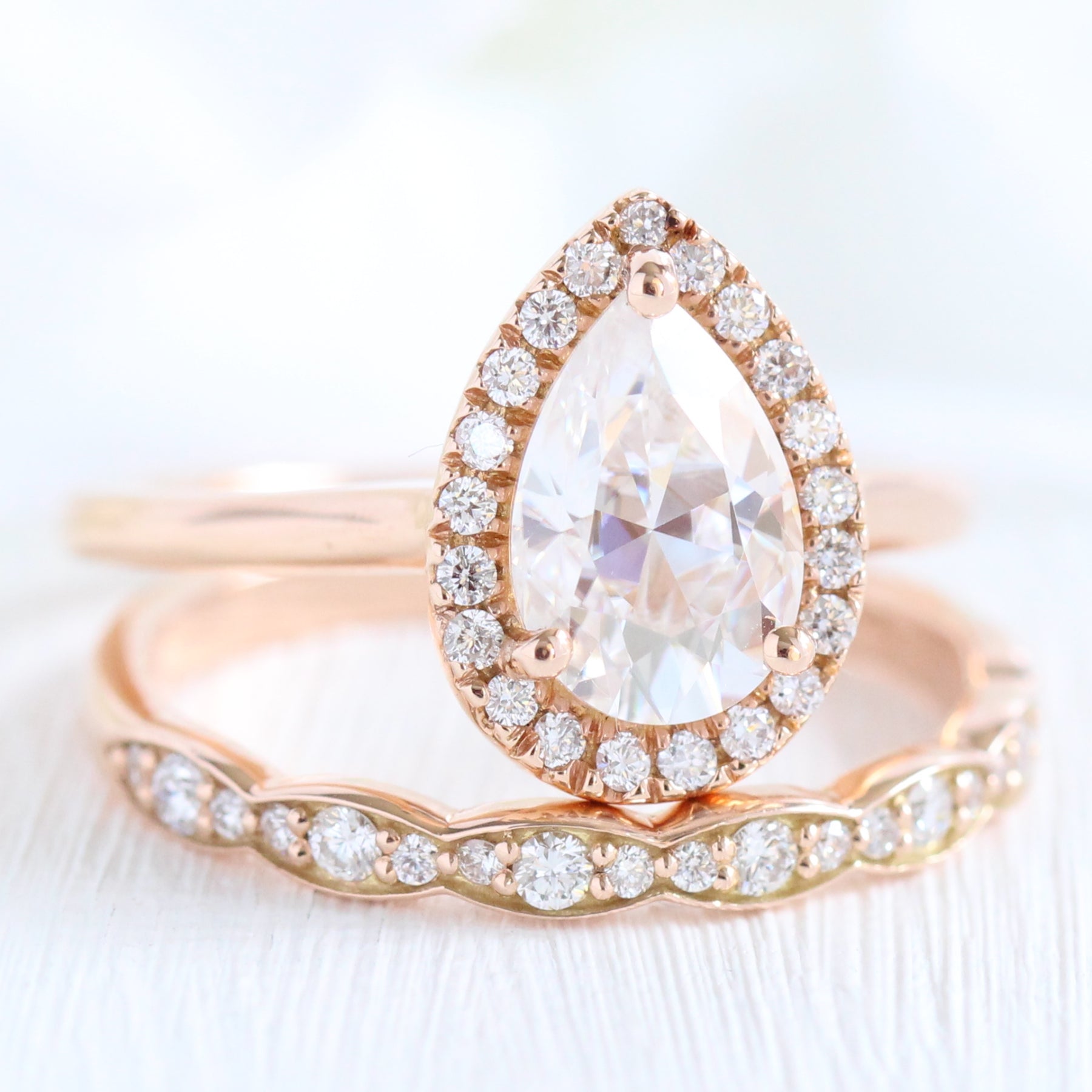 rose gold halo bridal set pear moissanite ring and scalloped diamond band by la more design jewelry