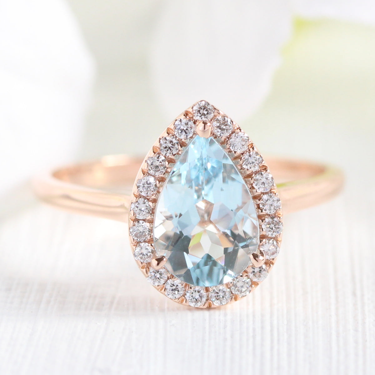 rose gold pear aquamarine halo diamond engagement ring by la more design jewelry