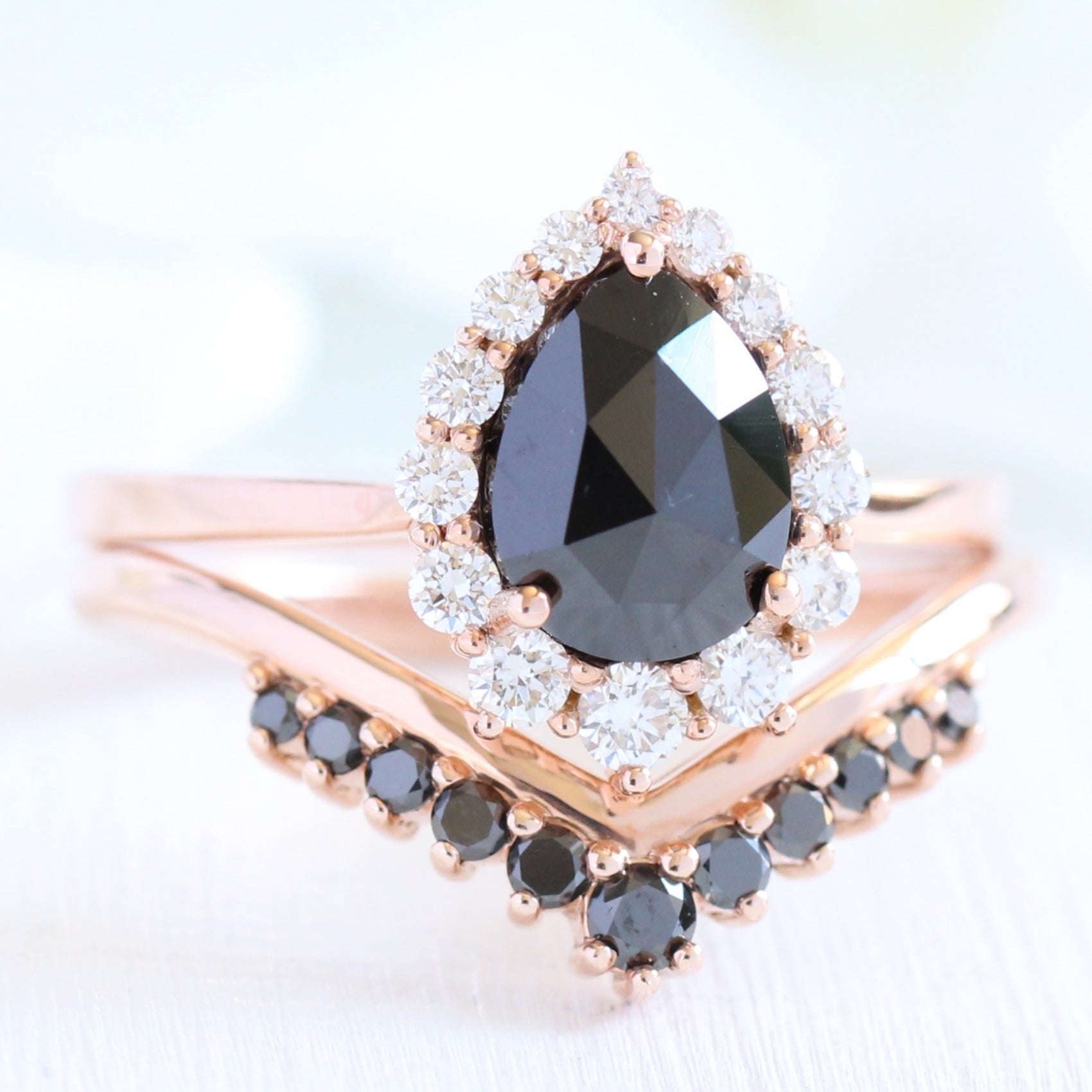 rose gold pear rose cut black diamond ring and v shaped diamond wedding ring set by la more design