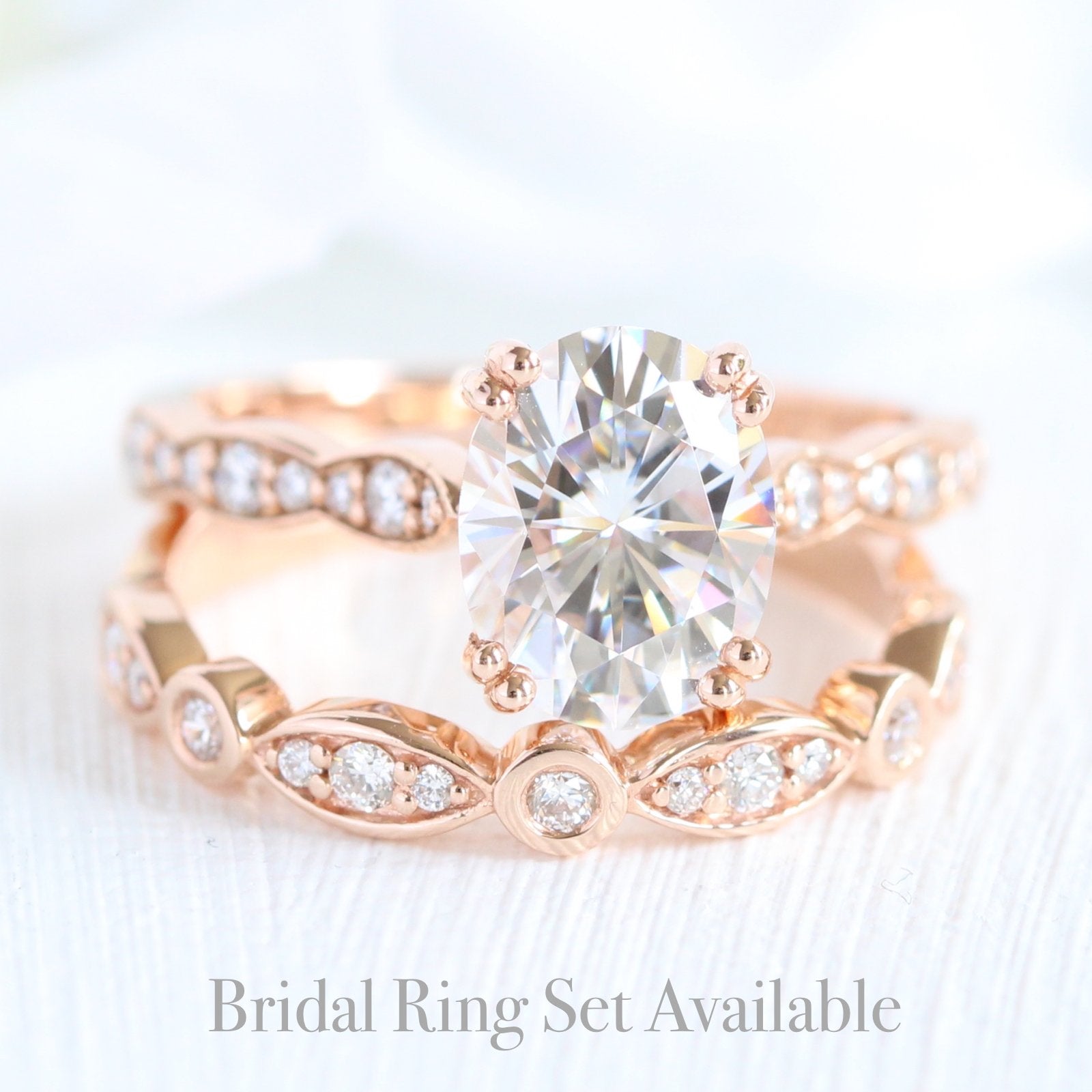solitaire moissanite ring bridal set in rose gold bezel diamond band by la more design