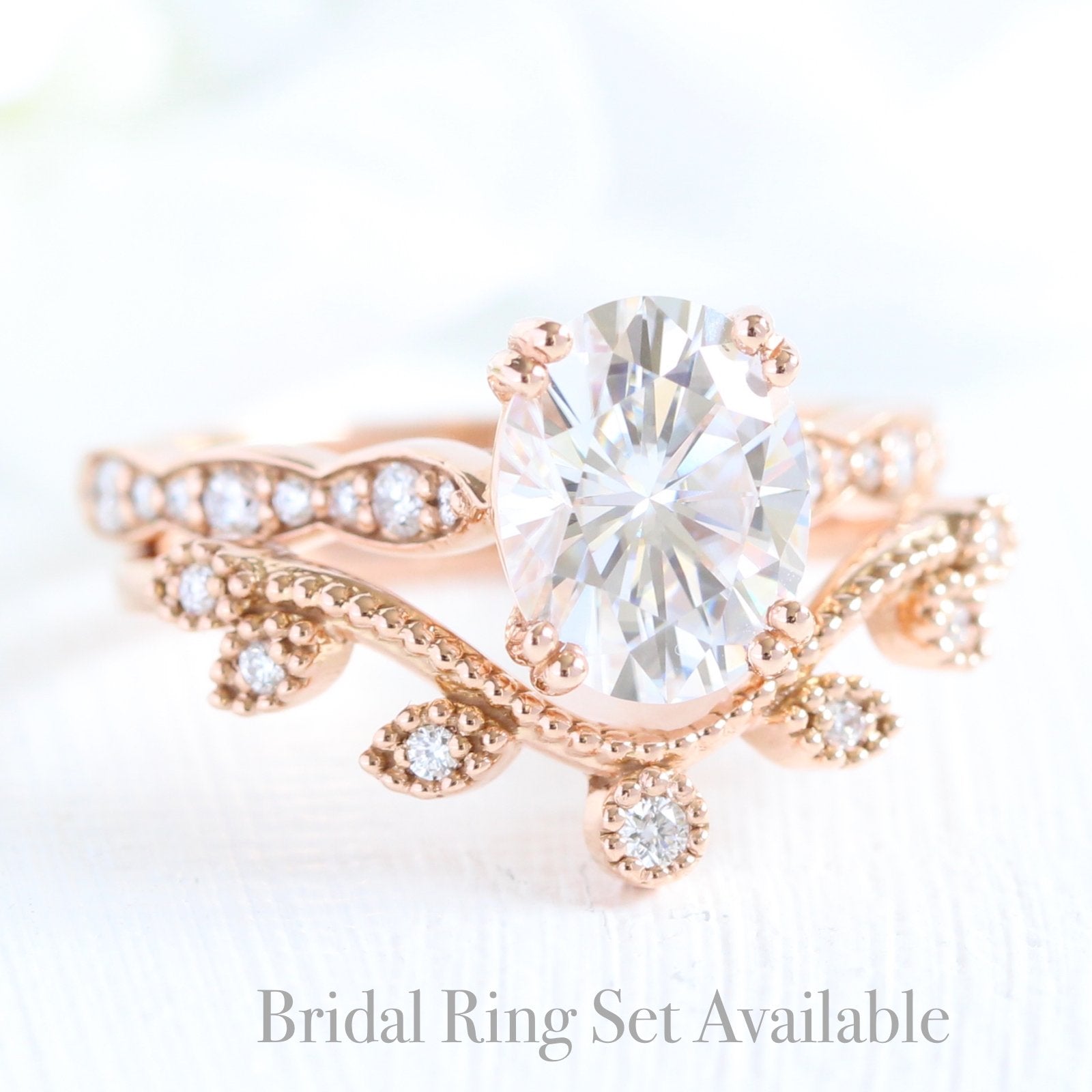 solitaire moissanite ring bridal set in rose gold curved leaf diamond band by la more design