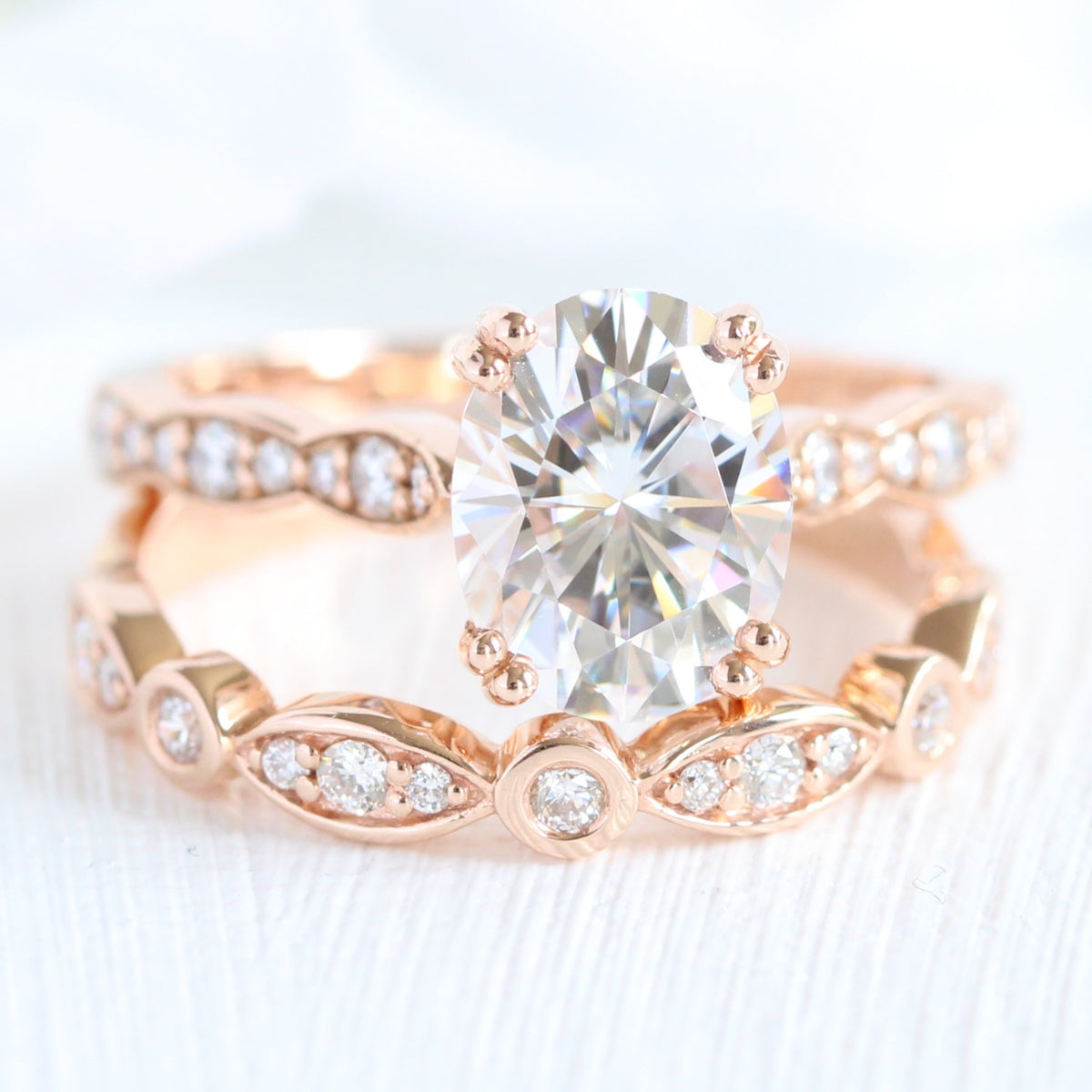 solitaire moissanite ring bridal set in rose gold bezel diamond band by la more design jewelry