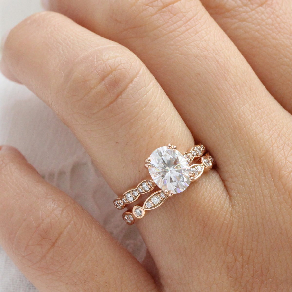 solitaire moissanite ring bridal set in rose gold bezel diamond band by la more design