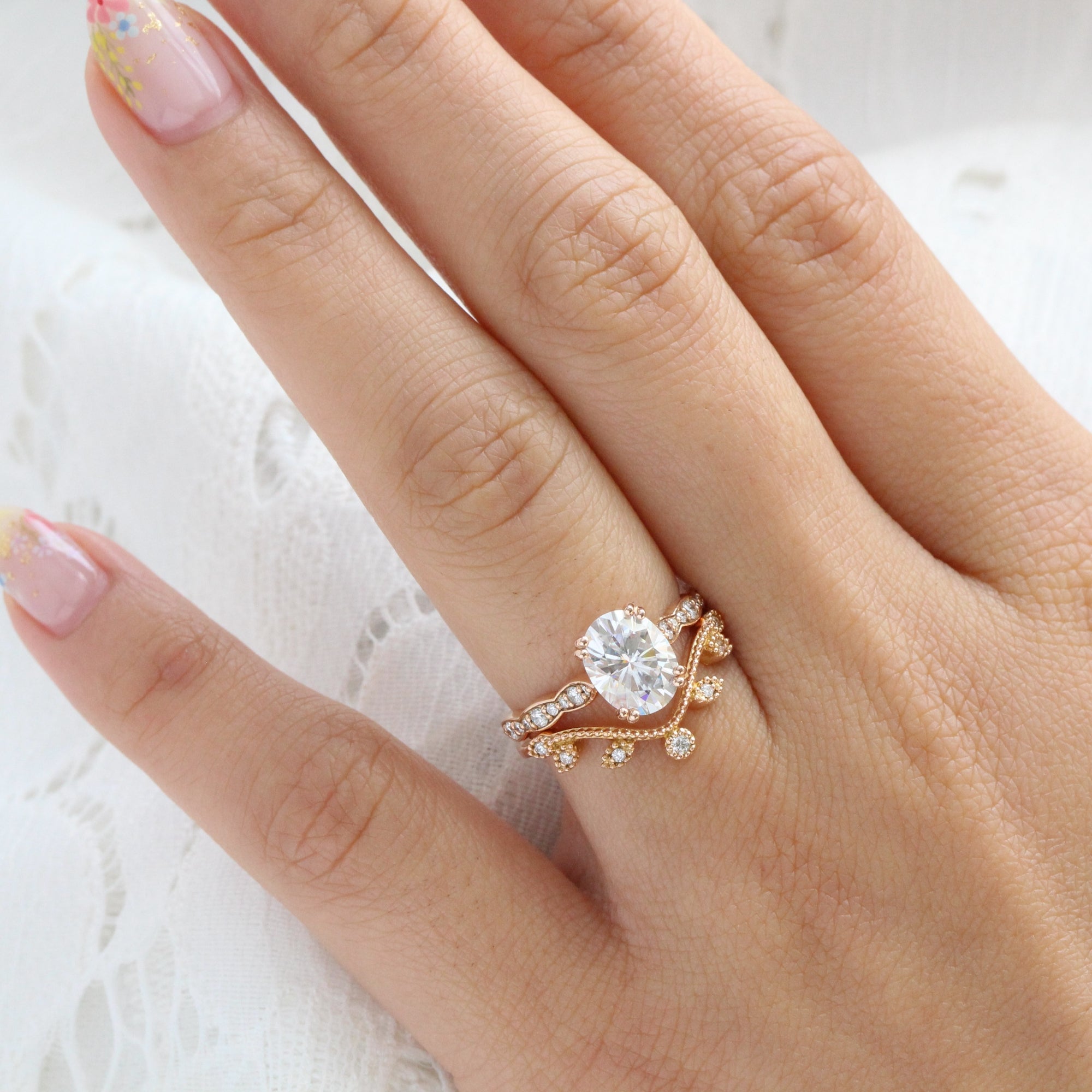 solitaire moissanite ring bridal set in rose gold curved leaf diamond band by la more design jewelry