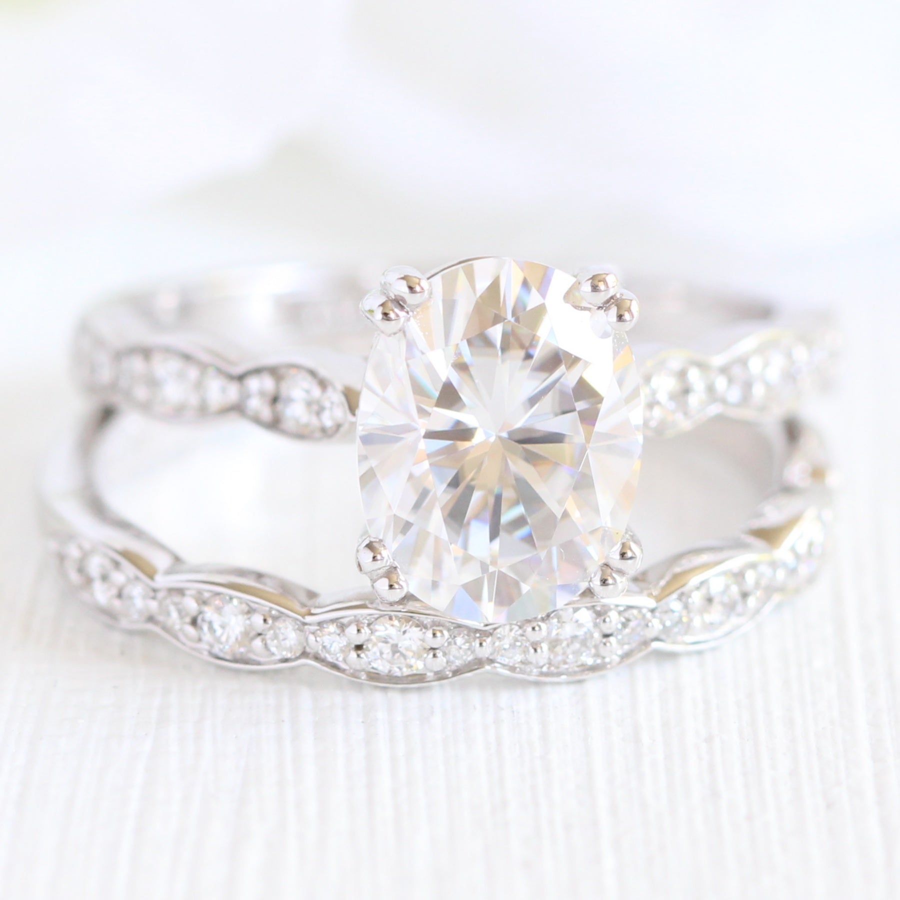 solitaire moissanite ring bridal set in white gold scalloped diamond band by la more design jewelry