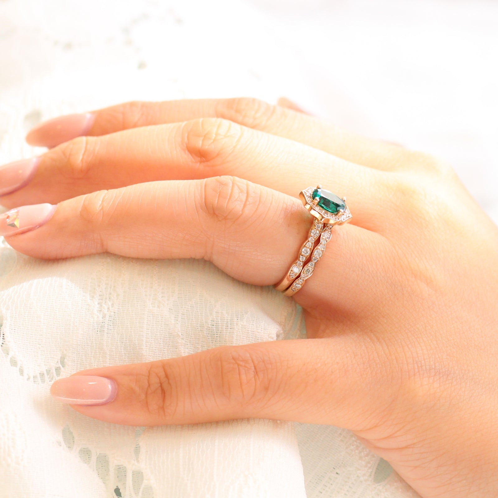 vintage inspired emerald ring and matching diamond wedding band in rose gold bridal set by la more design jewelry