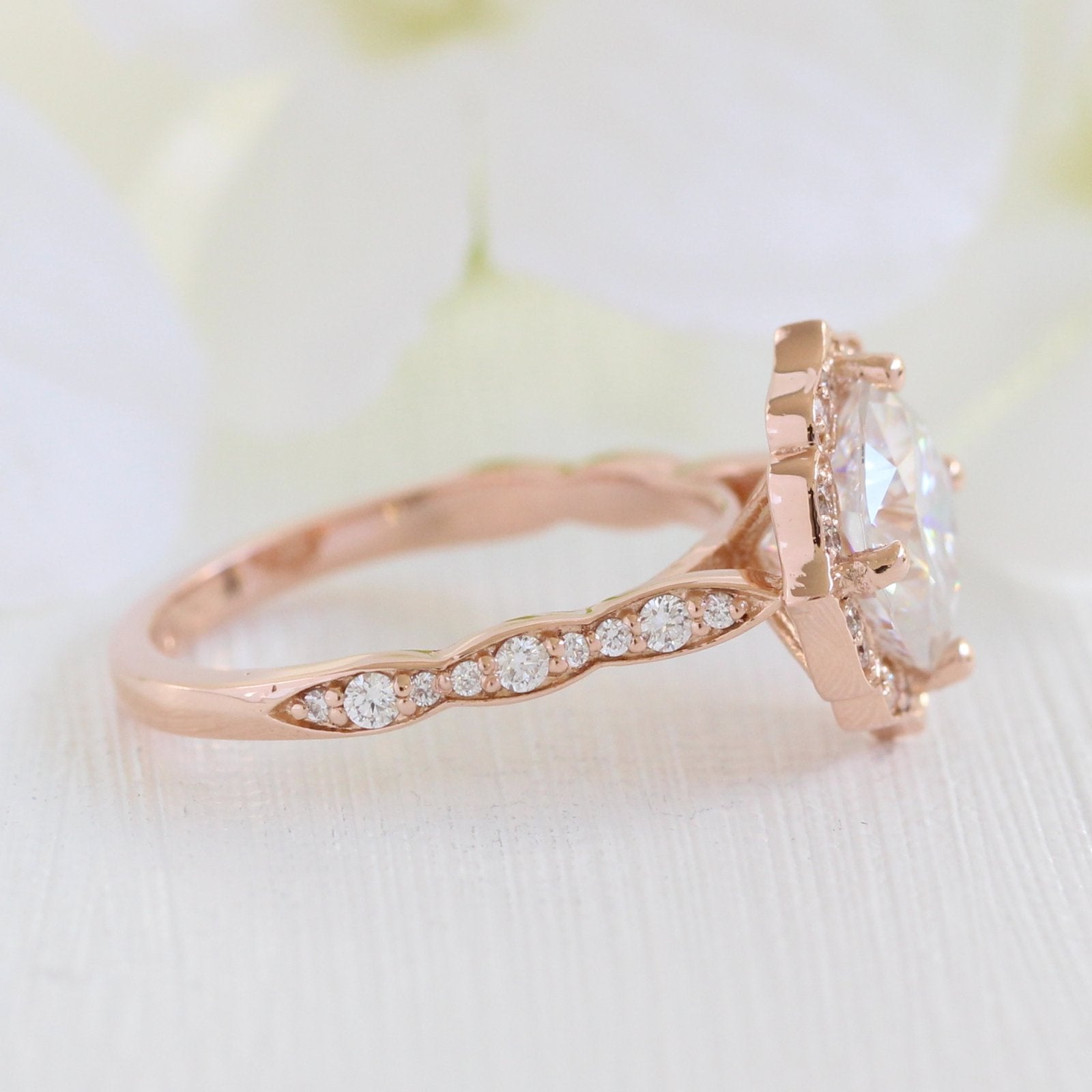 vintage inspired moissanite engagement ring in rose gold diamond band by la more design