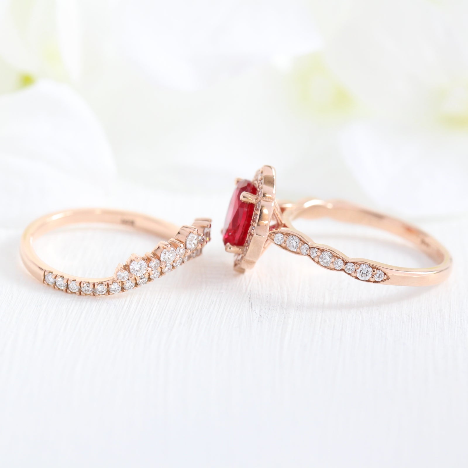 vintage inspired oval ruby ring and crown diamond wedding band in rose gold bridal set by la more design jewelry