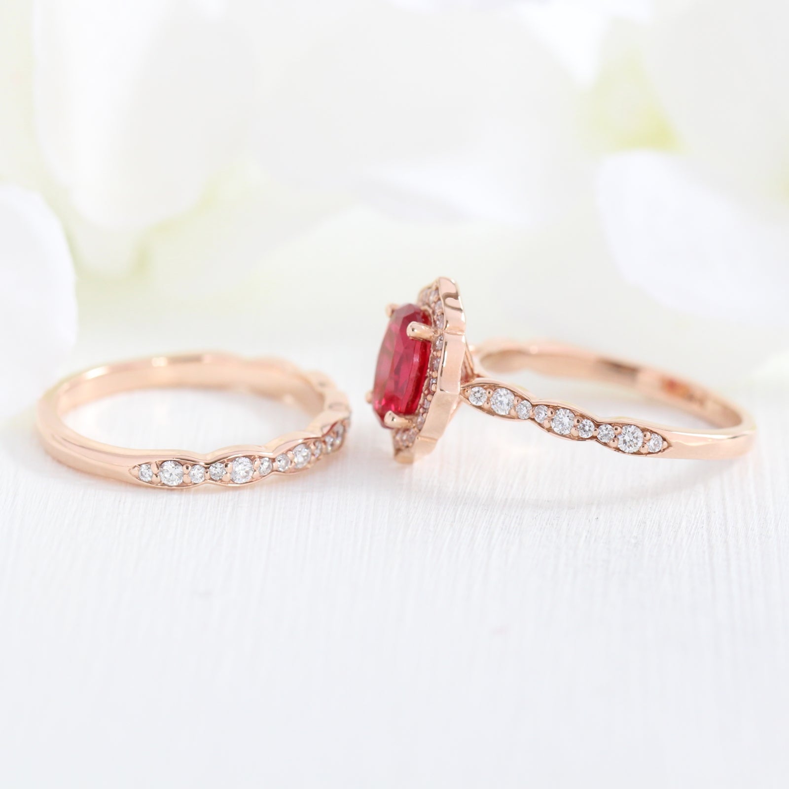 vintage style oval ruby ring and matching diamond wedding band in rose gold bridal set by la more design jewelry