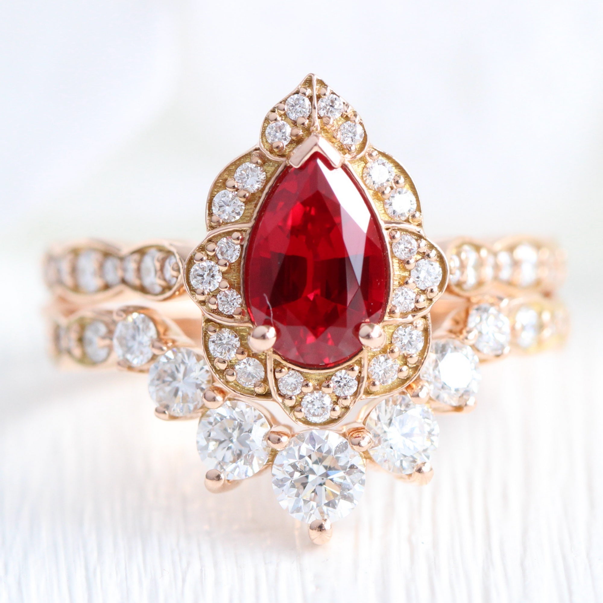 vintage halo diamond pear ruby ring stack rose gold curved diamond wedding band la more design jewelry