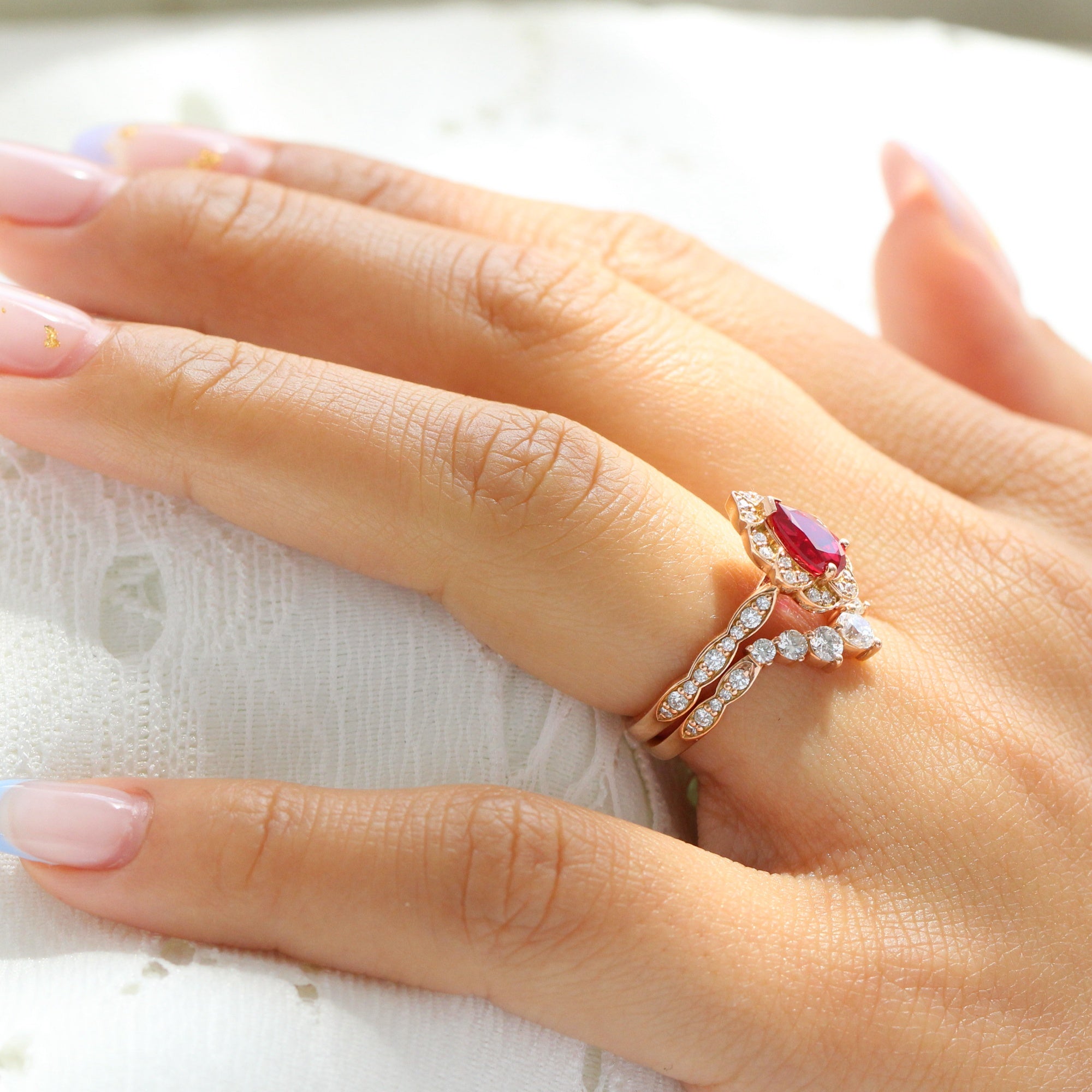 vintage halo diamond pear ruby ring stack rose gold curved diamond wedding band la more design jewelry