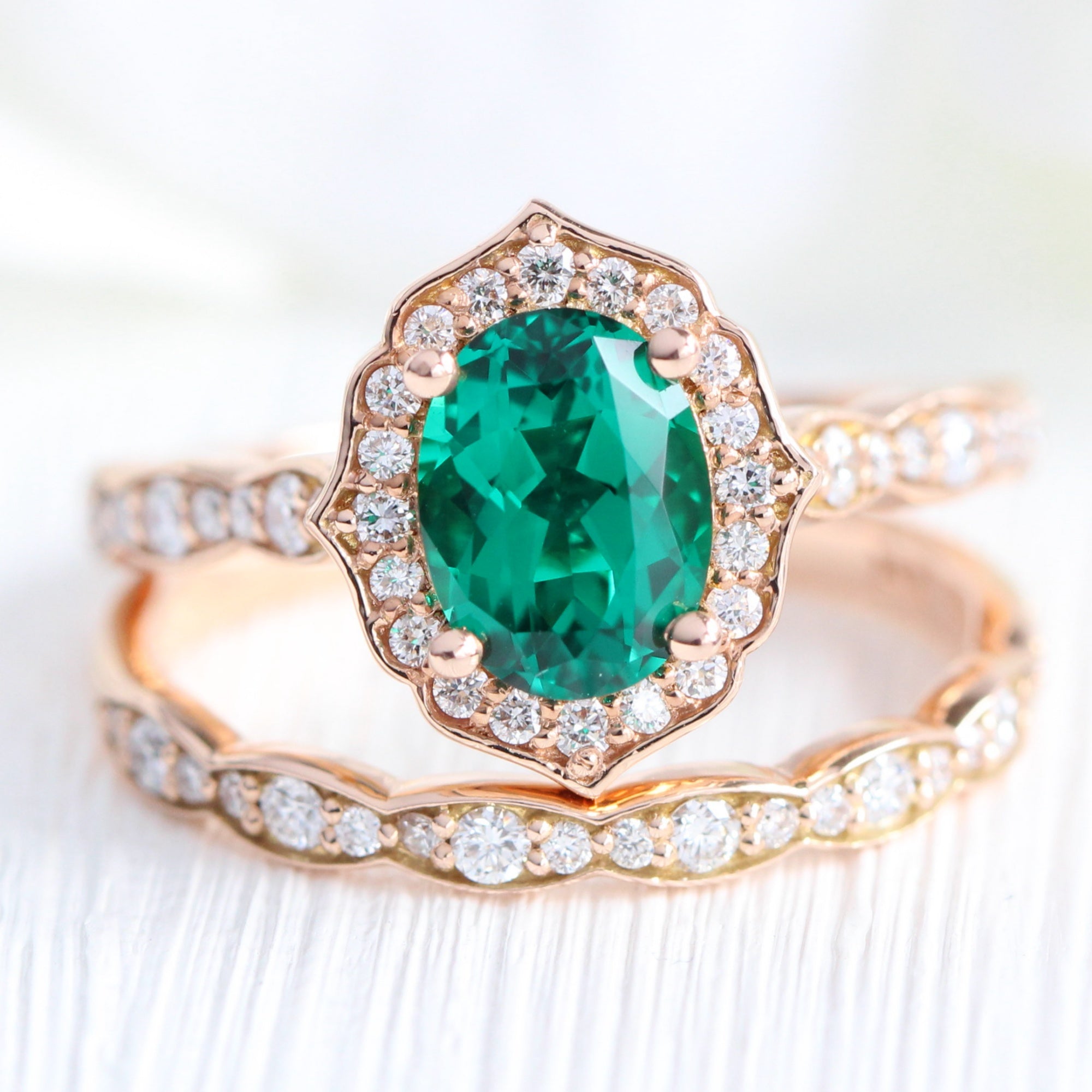 vintage inspired emerald ring and matching diamond wedding band in rose gold bridal set by la more design jewelry