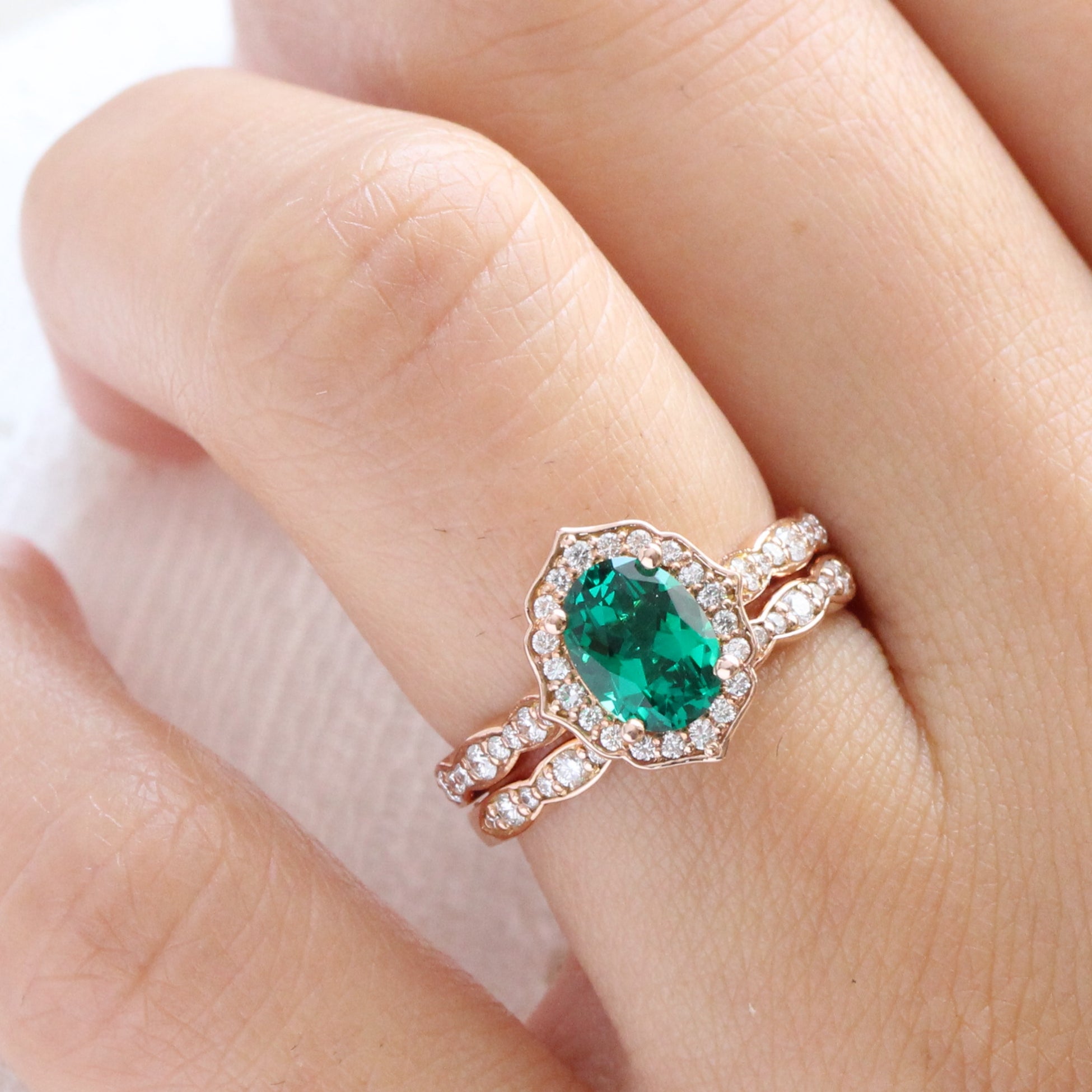 vintage inspired emerald ring and matching diamond wedding band in rose gold bridal set by la more design jewelry