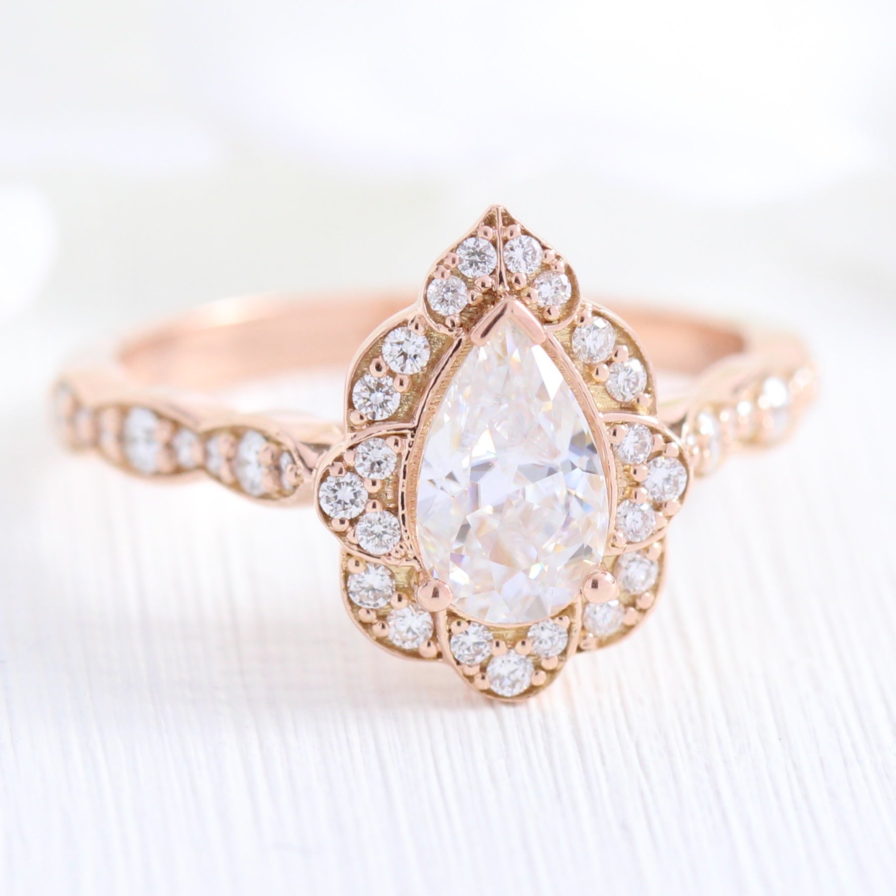 vintage inspired pear moissanite engagement ring in rose gold diamond scalloped band by la more design jewelry