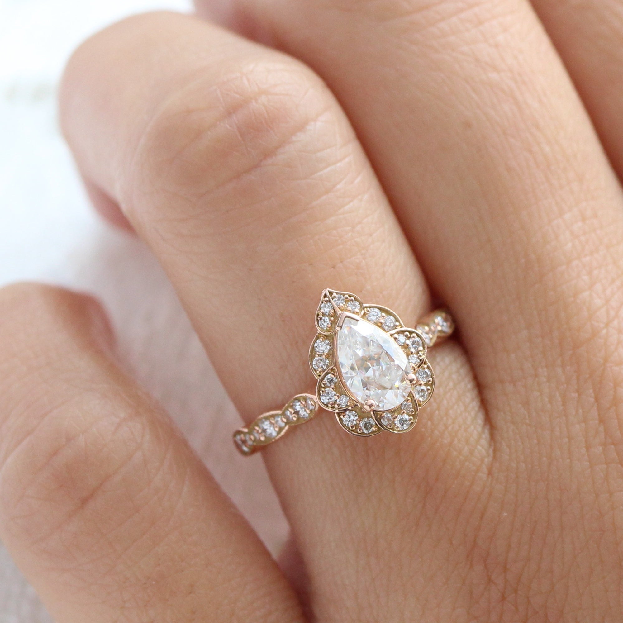 vintage inspired pear moissanite engagement ring in rose gold diamond scalloped band by la more design jewelry
