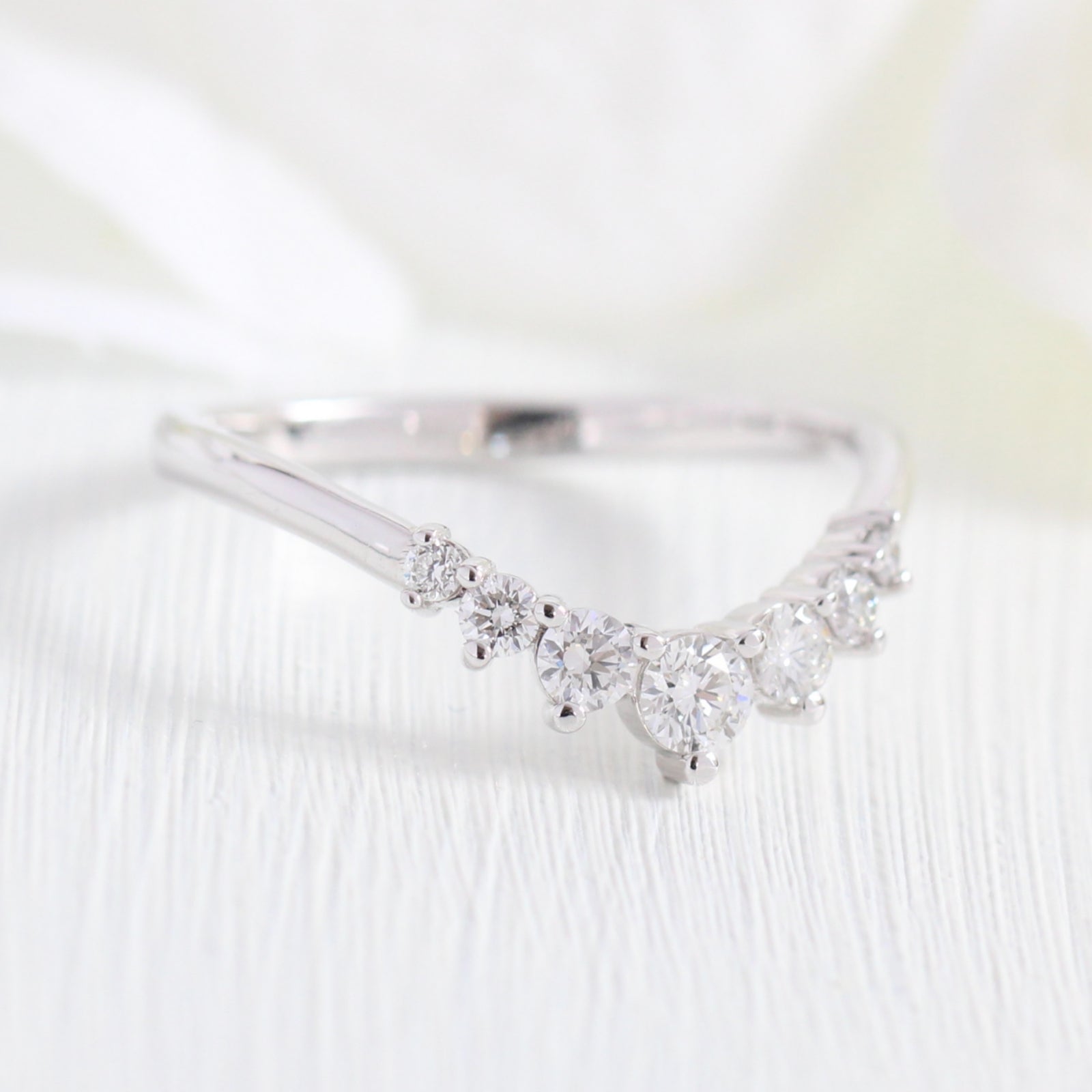 white gold curved diamond wedding ring in 7 stone diamond wedding band by la more design jewelry