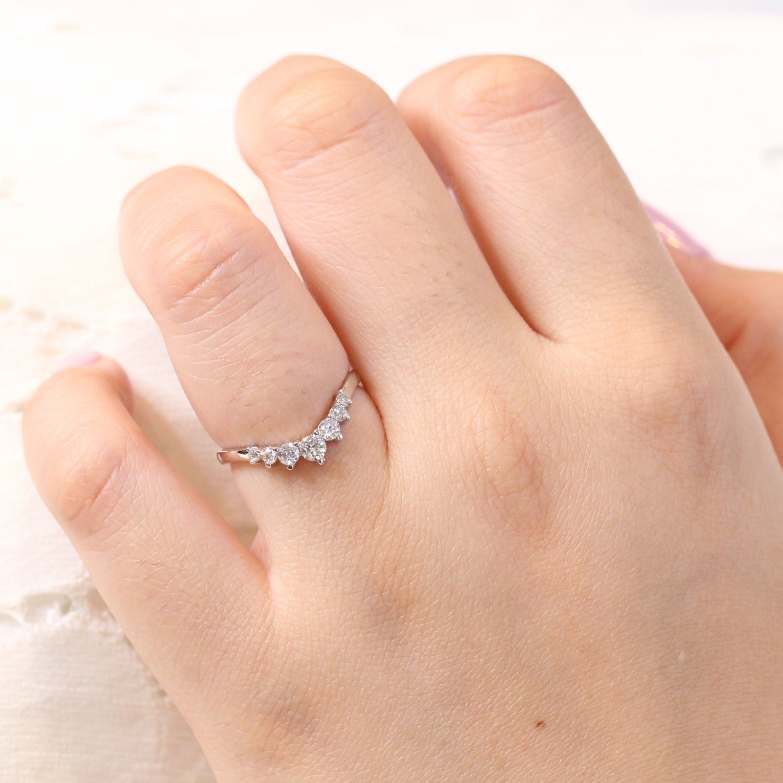 white gold curved diamond wedding ring in 7 stone diamond wedding band by la more design jewelry
